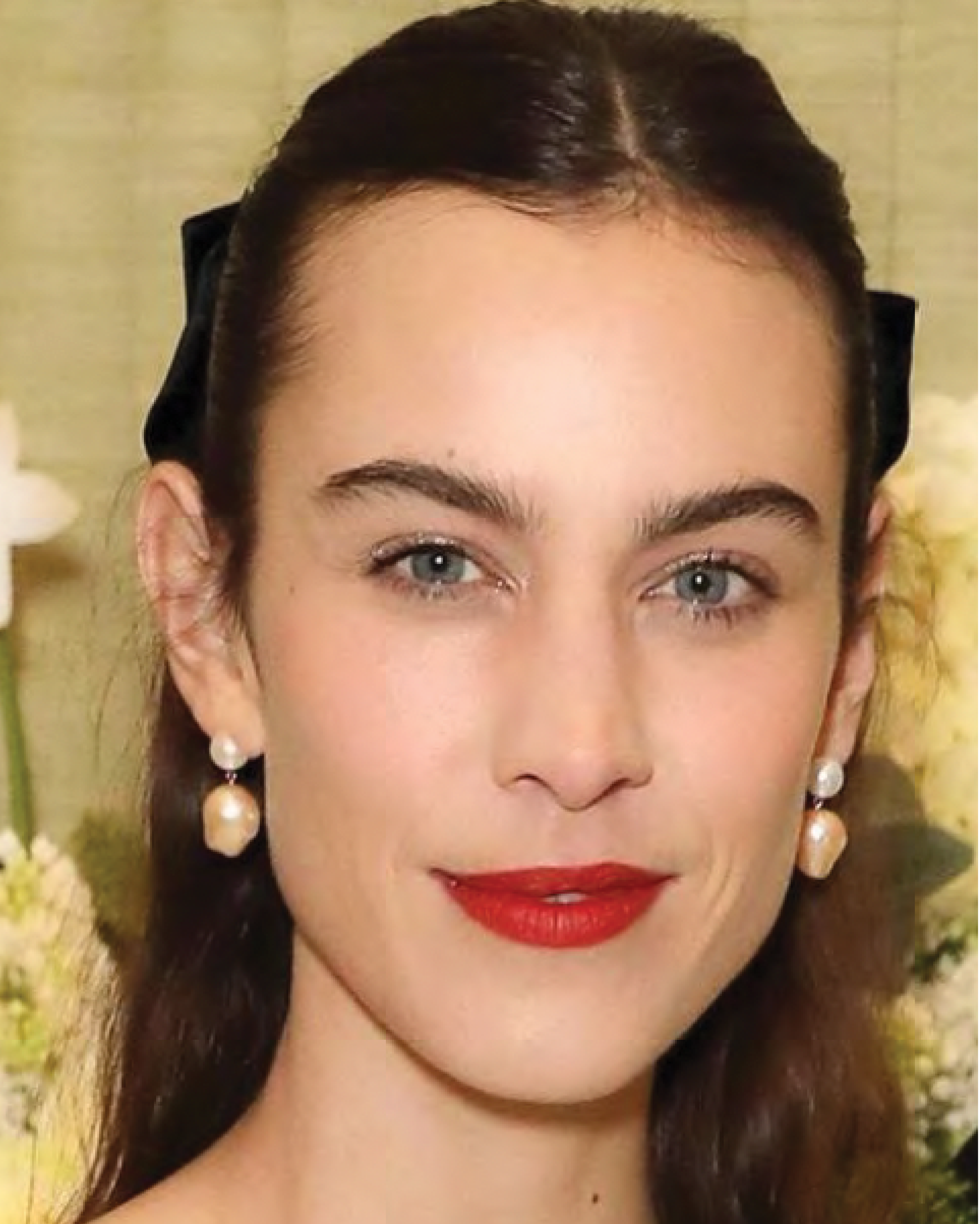 Alexa Chung is wearing the Venus Rose pearl earrings.
