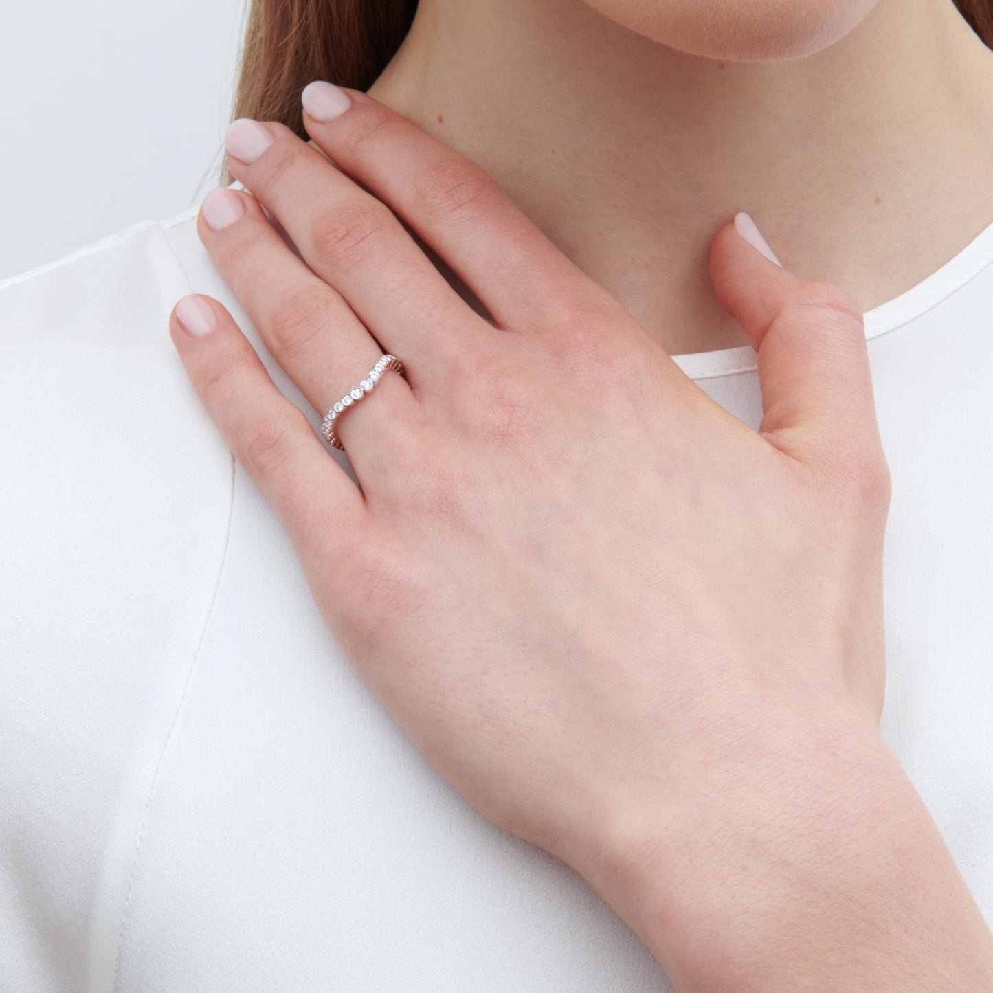 18K white gold wedding band with diamonds.