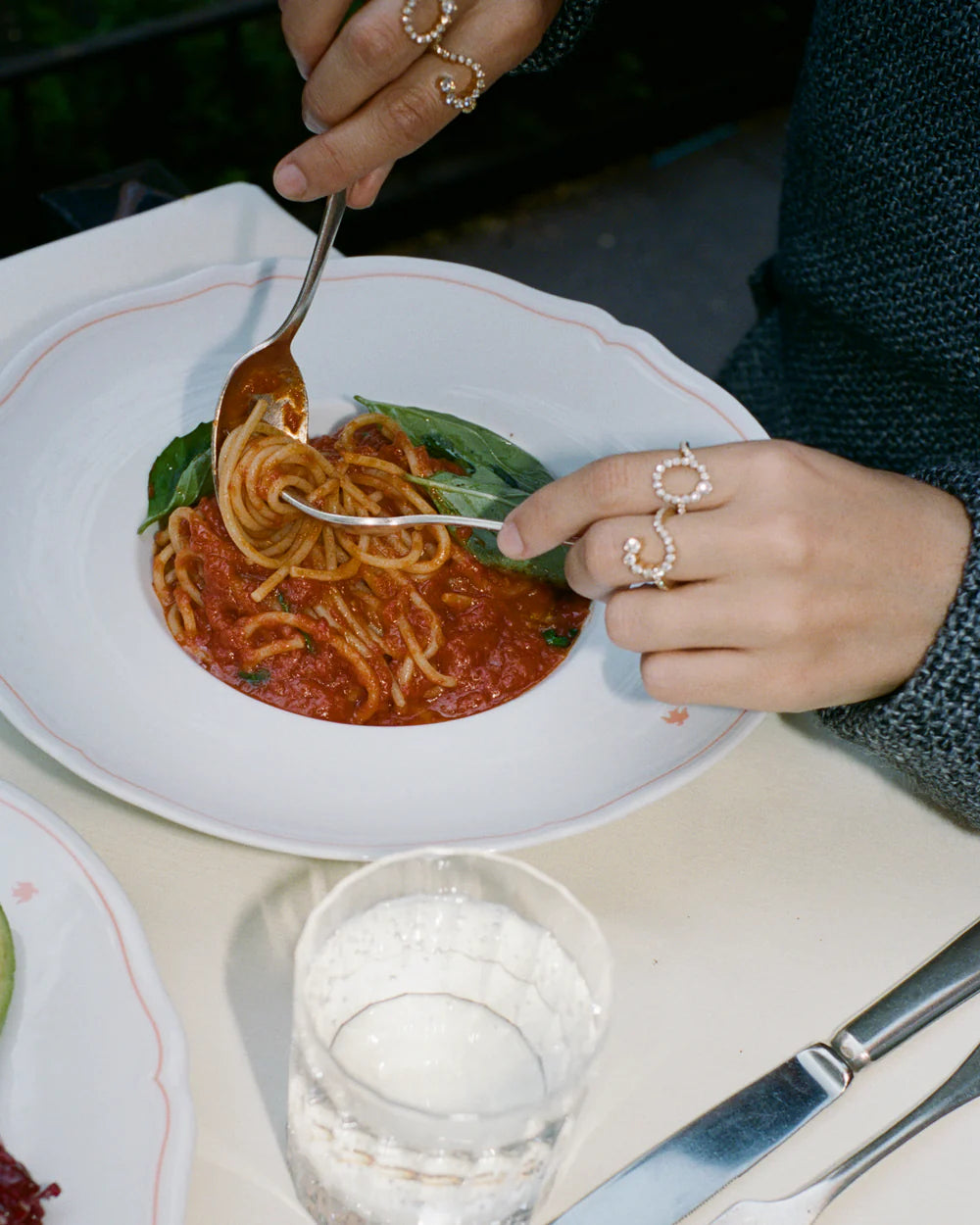 Coco wearing Ensemble C and Ensemble O.