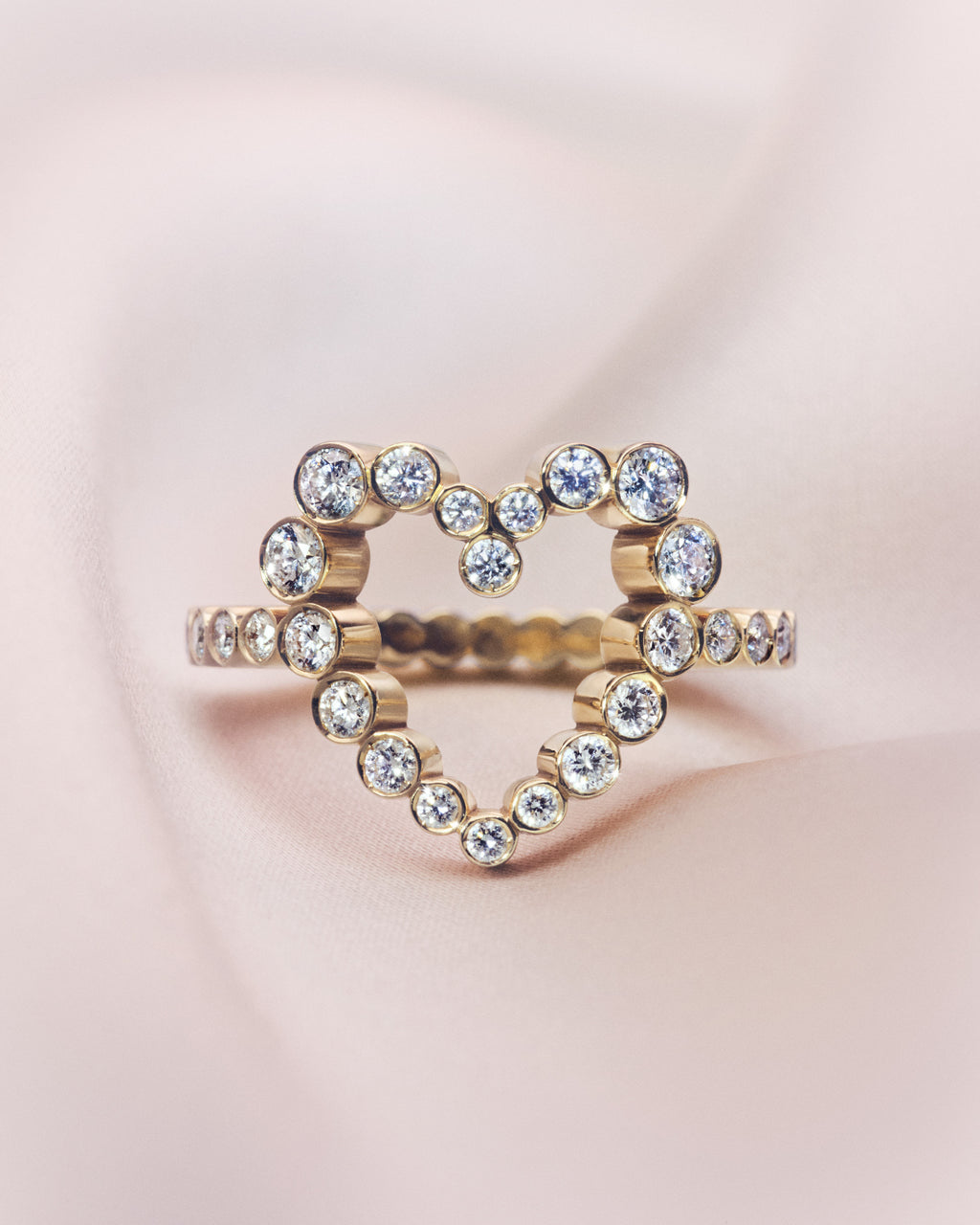18K yellow gold diamond ring shaped as a heart.