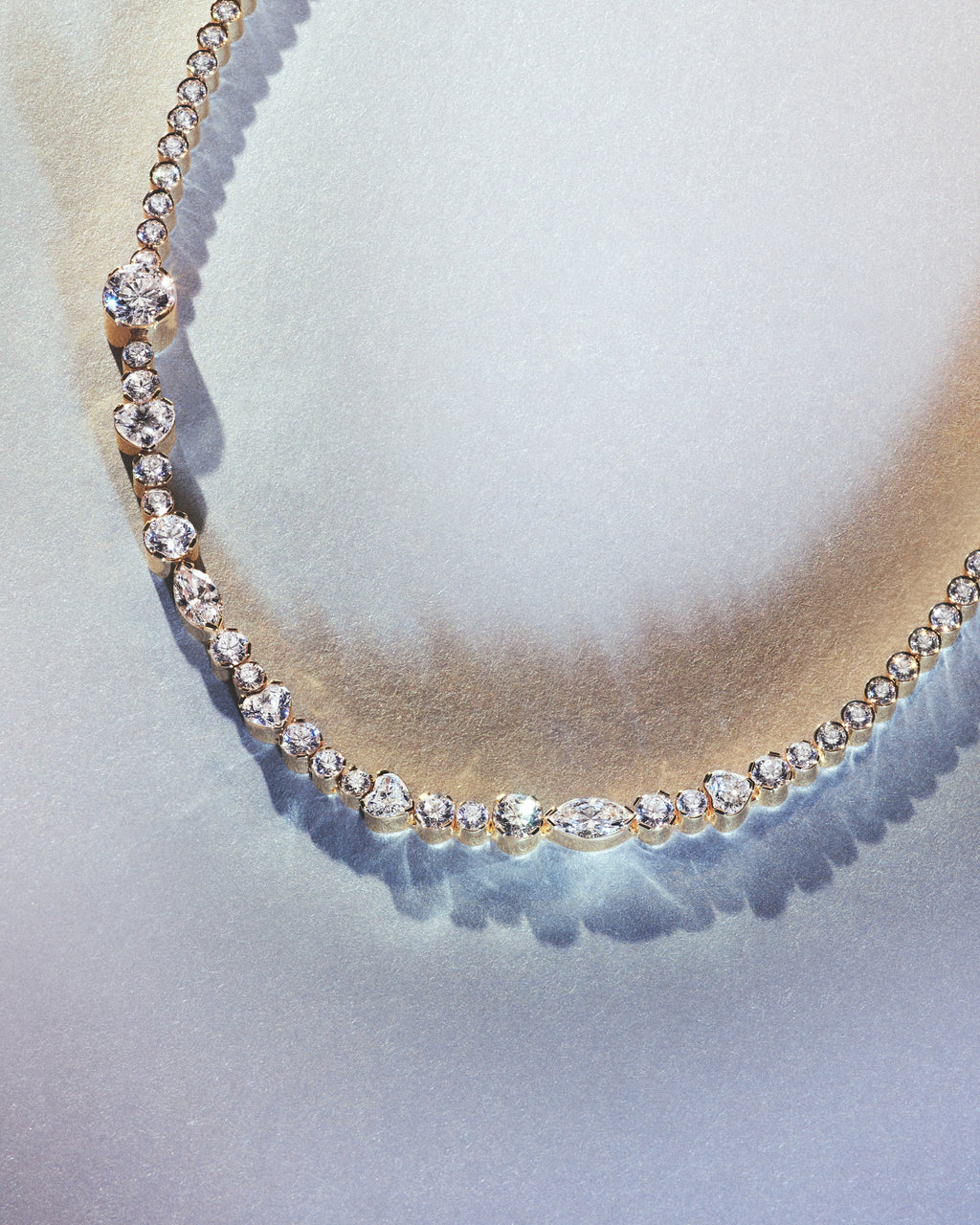 A diamond necklace with heart shaped diamonds.