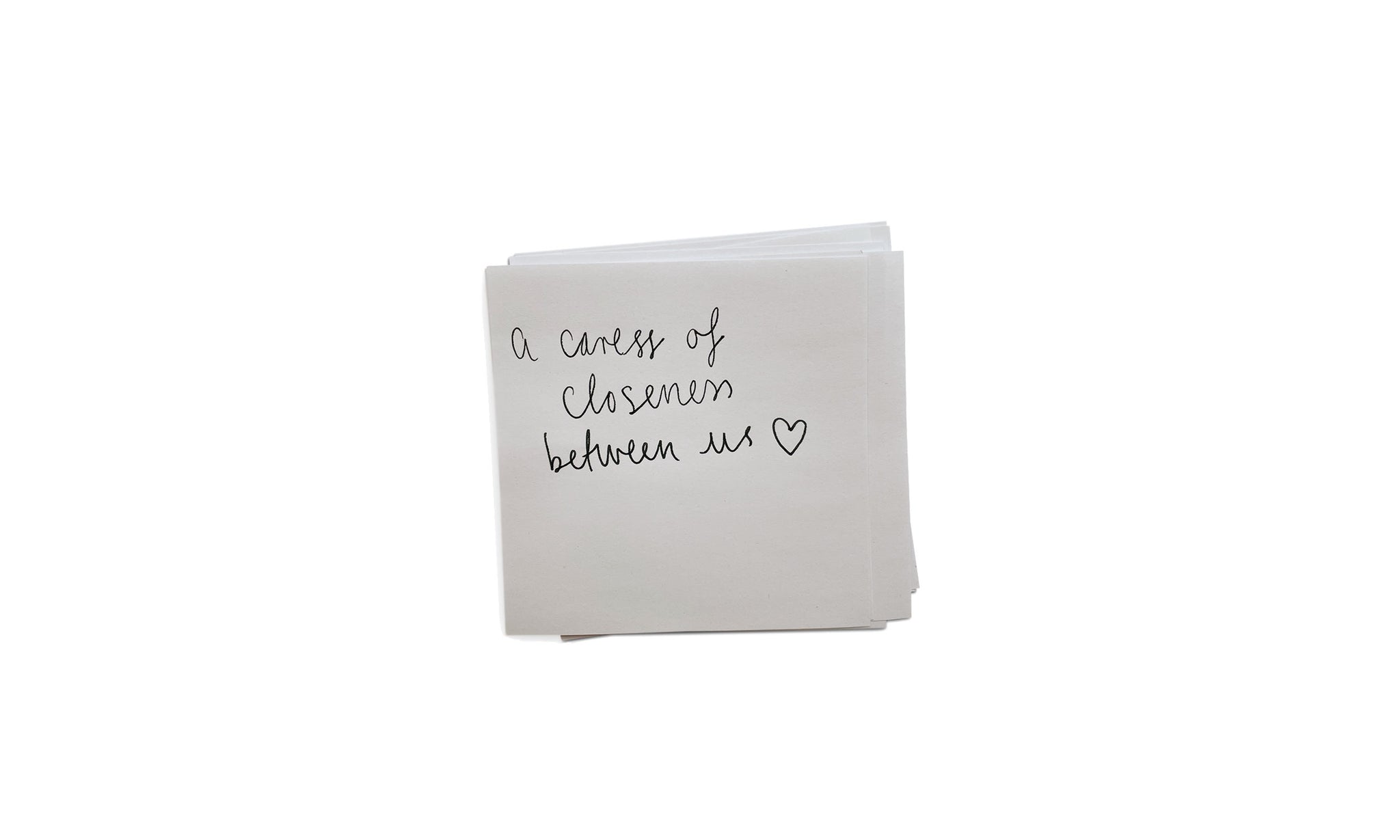 Handwritten note saying A caress of closeness between us