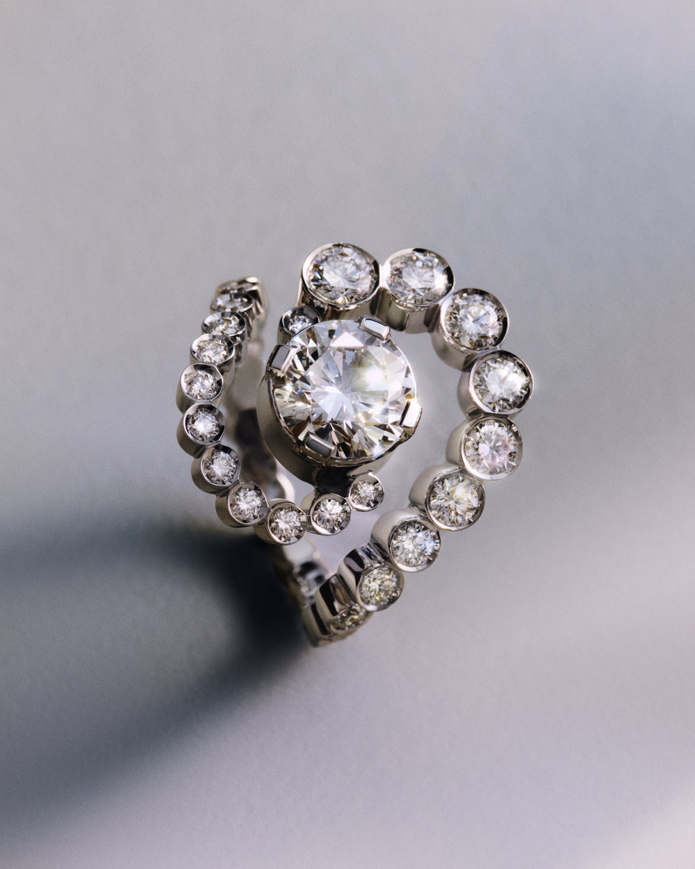 <p>With Sky 7, Sophie Bille Brahe reimagines the signature Gaia ring, defined by its minimal, structured arrangement of centred stones, refined here to its most essential form. Her interpretation of the founding myth of Uranus and Gaia – the personification of the sky and the earth in an endless embrace – is expressed through a swirling composition of diamonds.<br/><br/>Crafted in polished 18K recycled white gold, the Sky 7 ring centres around a prong-set 2.00 ct round brilliant-cut diamond of G colour and VVS1 clarity, Triple Excellent (3X), and is further set with 36 round brilliant-cut diamonds of G+ colour and VVS+ clarity in closed bezel settings, bringing the total carat weight to 3.51 ct.</p>