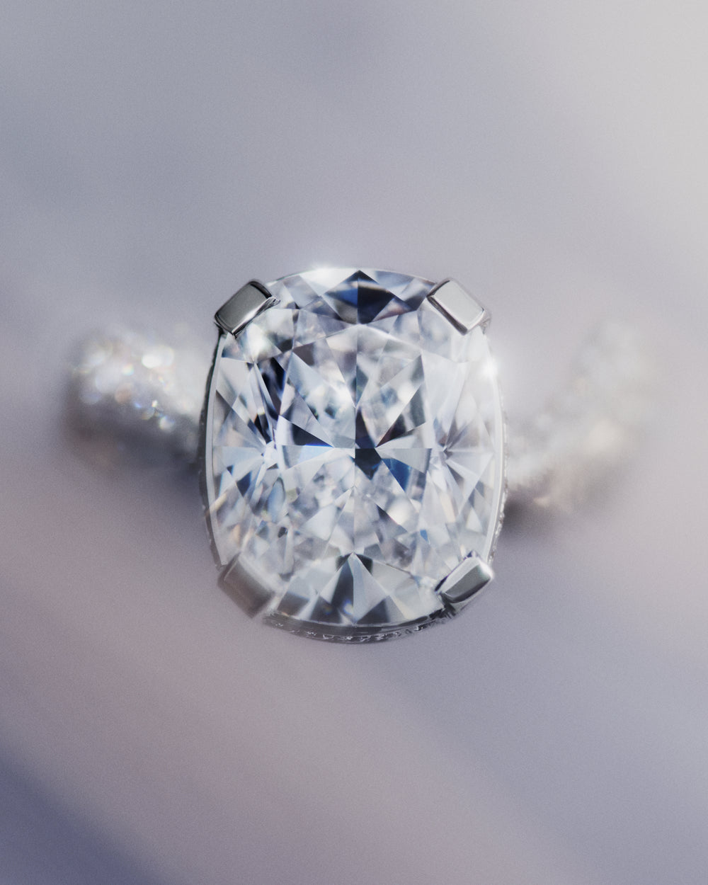 <p>The Sky 2 ring draws inspiration from the fleeting space between dreaming and waking. Part of the trilogy of rings, it reflects Sophie’s enduring ocean motif, reimagined herein a softer, more fluid form. Designed to be worn on the pinky finger. <br/><br/>Sky 2 is crafted in 18K white gold and centred around a prong-set 5.03 ct cushion brilliant-cut diamond of D colour and Flawless clarity. A rare Type IIa diamond, renowned for its exceptional purity and transparency. The ring is further set with 187 round brilliant-cut diamonds in a delicate pavé setting, bringing the total carat weight to 6.24 ct.</p>