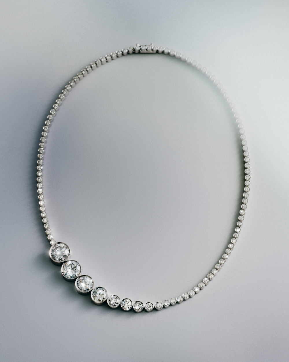 <p>The Sky 6 necklace reimagines Sophie Bille Brahe’s signature Collier de Tennis at its fullest scale. Rooted in the idea of making something substantial feel light enough to wear every day, the piece continues Sophie’s ongoing exploration of balance between the large and the small, the bold and the delicate.<br/><br/><br/>Composed of round brilliant-cut diamonds ranging from 5.01 ct to 1.00 ct, the Sky 6 necklace unfolds continuously along the neckline. Crafted in 18K white gold and includes a 5.01 ct round brilliant-cut diamond of G colour and VVS1 clarity, Triple Excellent(3X), a 4.01 ct stone of the same grading, a 3.01 ct round brilliant-cut diamond,also G, VVS1 Triple Excellent, a 2.00 ct G, VVS1 Triple Excellent diamond and a 1.00 ct round brilliant-cut diamond of G colour and VVS2 clarity, Triple Excellent (3X). The necklace is further set with 106 round brilliant-cut diamonds of G+ colour and VVS+ clarity in bezel settings, bringing the total carat weight to 27 ct.</p>