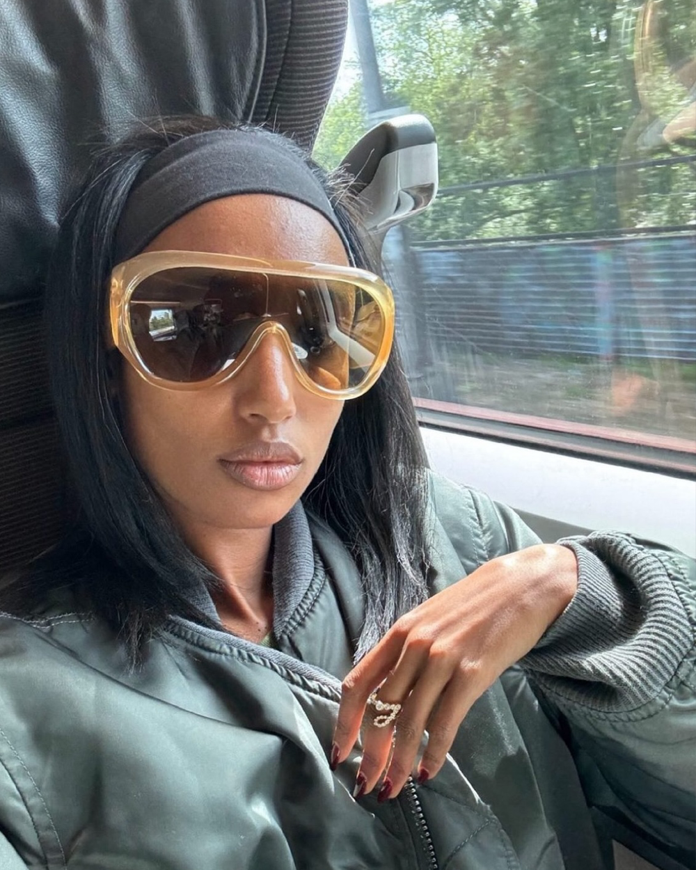 Model Julia Sarr Jamois wearing the Ensemble J diamond letter ring.