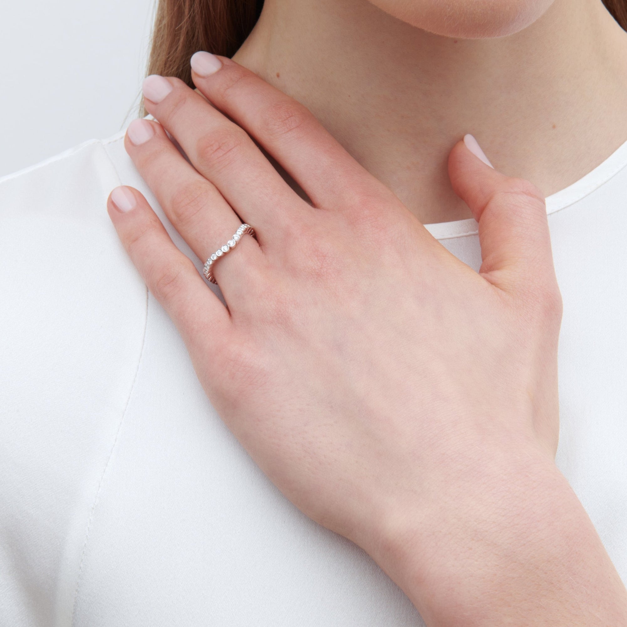 18K white gold wedding band with diamonds.